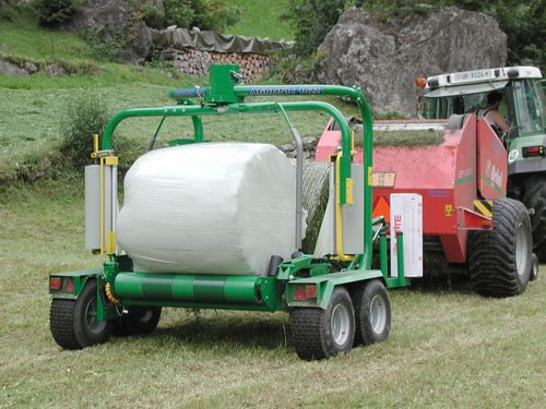Линейный упаковщик тюков - 1022,1025 - AGRONIC OY - для круглых кип / автоматический / прицепной