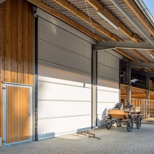 Дверь для амбара - Lubratec® Stabidoor - HUESKER Synthetic GmbH - для хлева / для хранилища / из алюминия